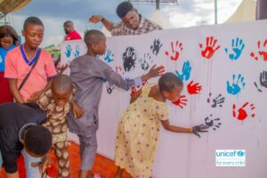 Children stamping out FGM at the event.