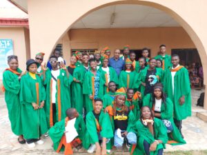 Mass Communications Matriculants with one of their lecturers, Rev. Fr. Femi Adetunji.